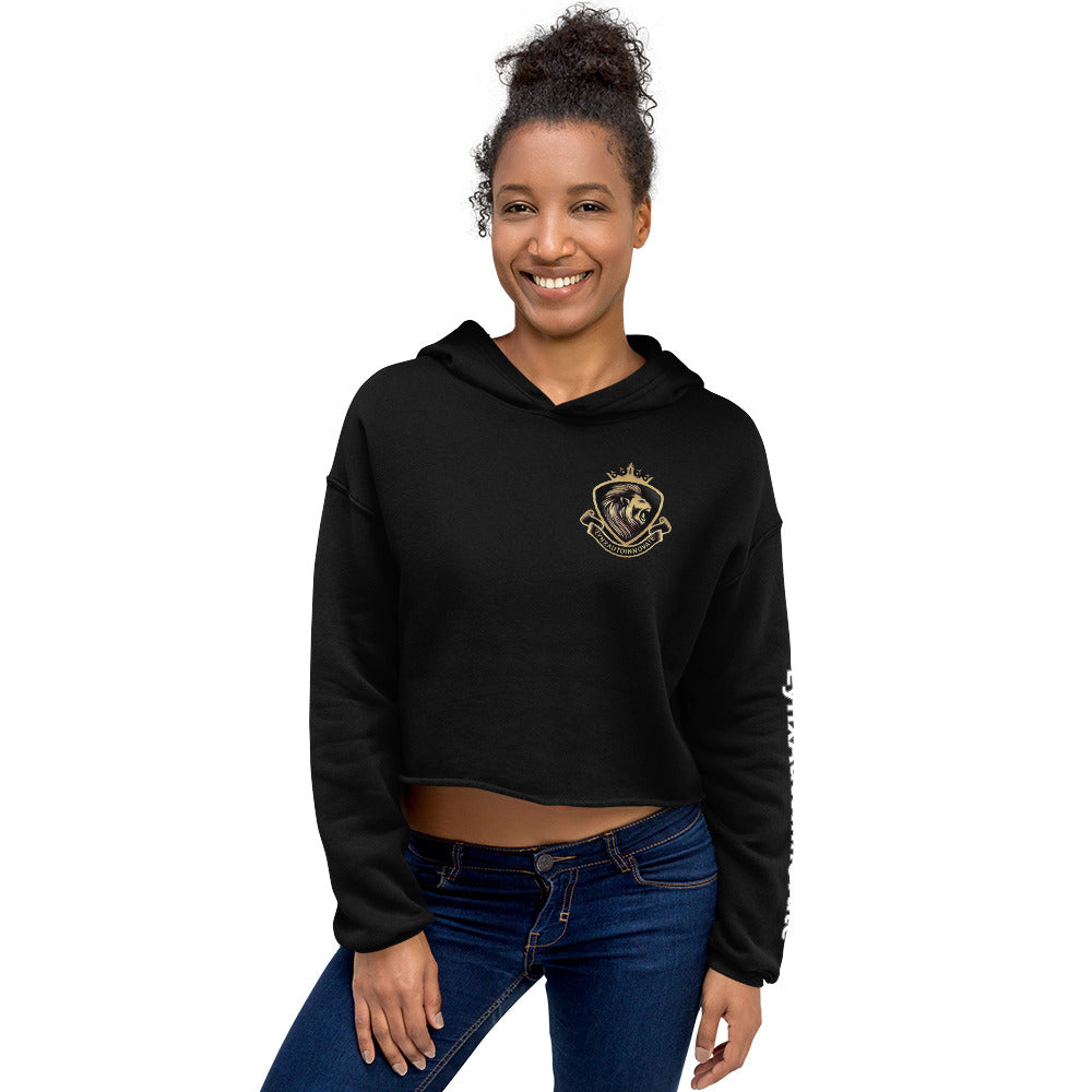 Woman wearing black LynXautoinnovate cropped hoodie with gold automotive logo, front view