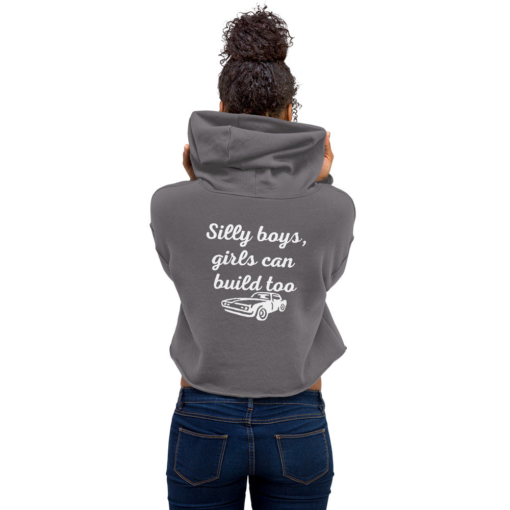 Back view of woman wearing gray cropped hoodie with 'Silly boys, girls can build too' text and car graphic, LynXautoinnovate automotive apparel