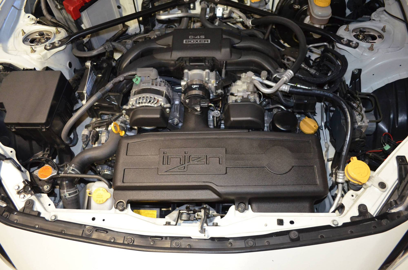 Clean Subaru D-4S Boxer engine with Injen intake in white car, LynXautoinnovate automotive parts