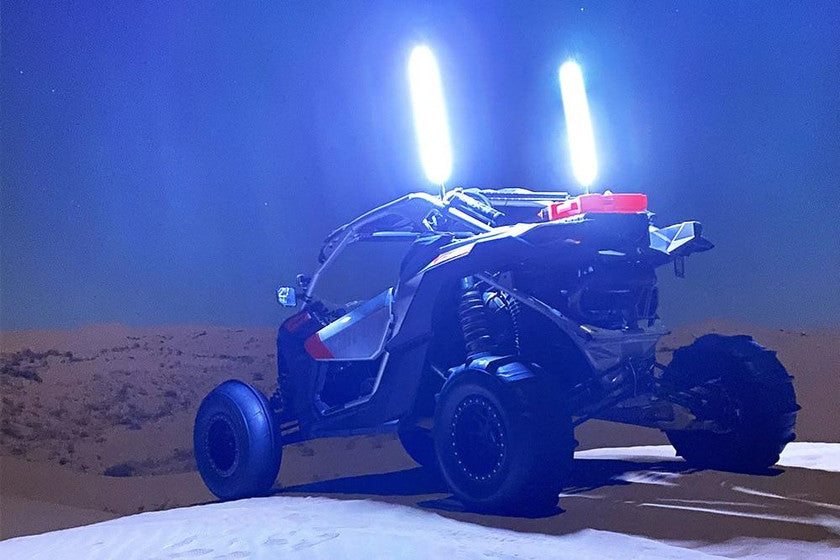 Off-road dune buggy with bright LED light whips at night in desert, LynXautoinnovate™ USA