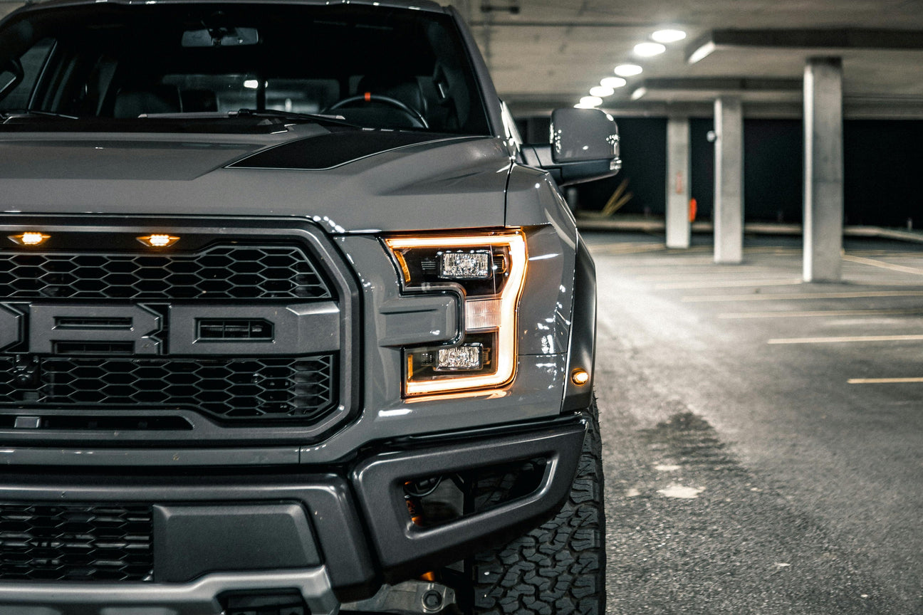 Closeup of gray pickup truck front with LED lights in a parking garage, LynXautoinnovate automotive parts