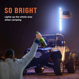 Off-road vehicle with bright LED whip light and USA flag, camping at night, LynXautoinnovate™ accessories