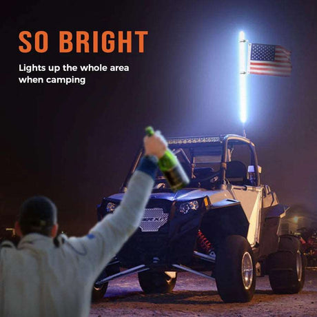 Off-road vehicle with bright LED whip light and USA flag, camping at night, LynXautoinnovate™ accessories