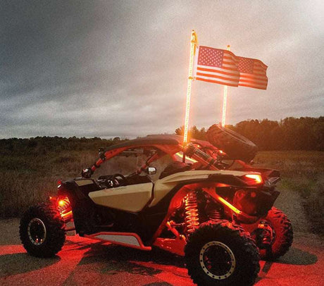 Off-road UTV with LED light whips and American flags at sunset, LynXautoinnovate automotive parts USA