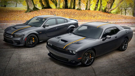 Two sporty black Dodge cars with yellow racing stripes parked outdoors, LynXautoinnovate USA automotive parts accessories