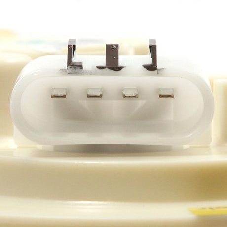 Close-up of a white electronic component on a beige background