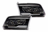 Pair of black in housed Truck headlights with a white background