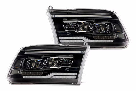 Pair of black in housed Truck headlights with a white background