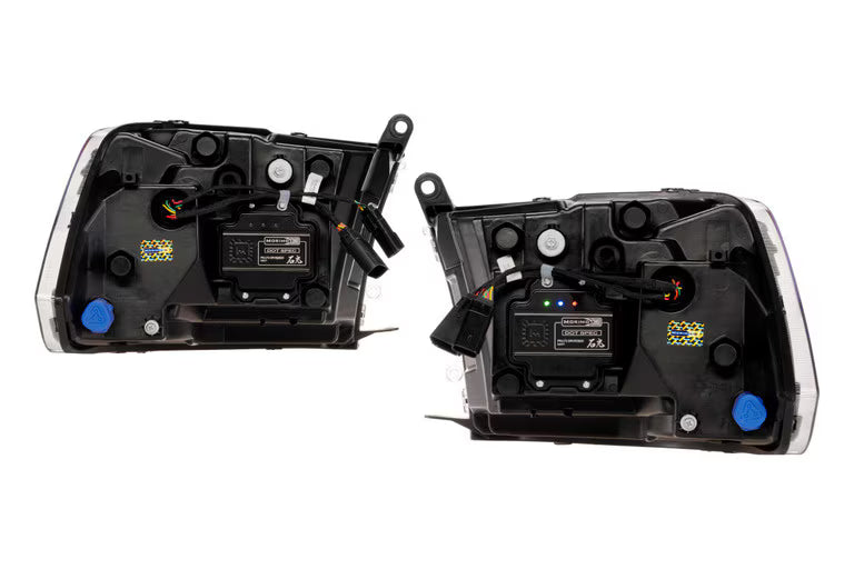 Two truck headlight assemblies viewing the back of the headlights. shows plug and play accessibility with a white background