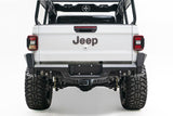 Back view of a white Jeep truck with visible branding on a white background