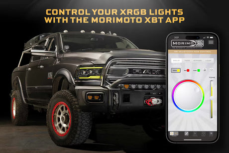 Black off-road vehicle with Morimoto XRGB lights and a smartphone displaying the XBT app.