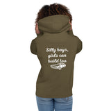 Woman wearing military green hoodie with 'Silly boys, girls can build too' and car graphic on back for LynXautoinnovate automotive accessories.