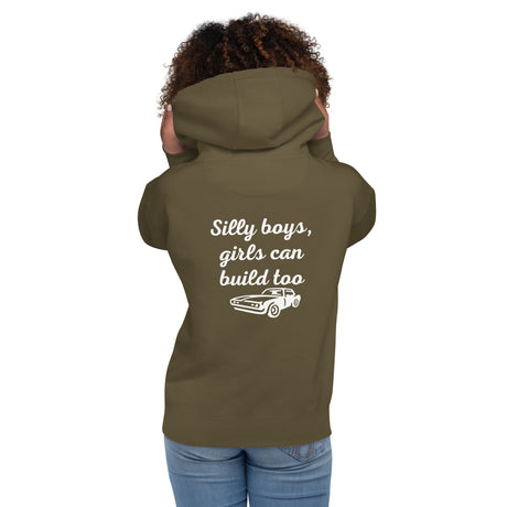 Woman wearing military green hoodie with 'Silly boys, girls can build too' and car graphic on back for LynXautoinnovate automotive accessories.